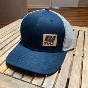 TVG Black and Tan Trucker Hat with Leather TVG Logo Patch Horse Racing